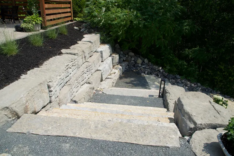 Upper section of the stone staircase with retaining walls on either side